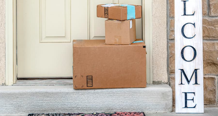 Deliveries on the front porch of a house with a welcome sign in Chattanooga